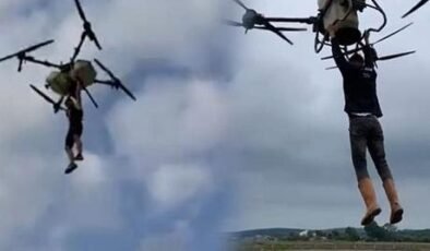 Çeltik tarlasında akılalmaz anlar! Tutunduğu dronla havalandı: Düşme anı kamerada